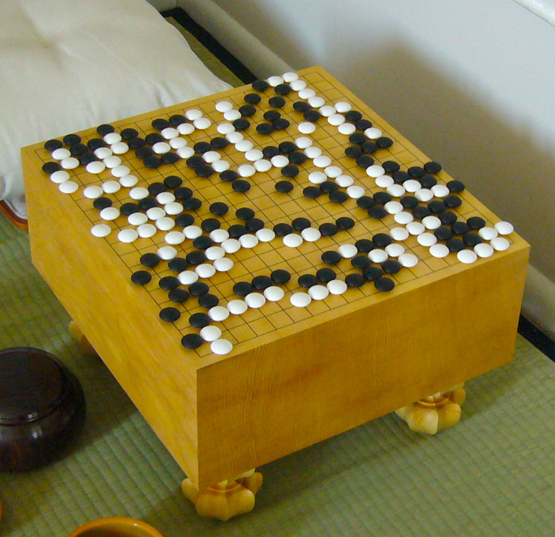 game of go board with a game in the end phase